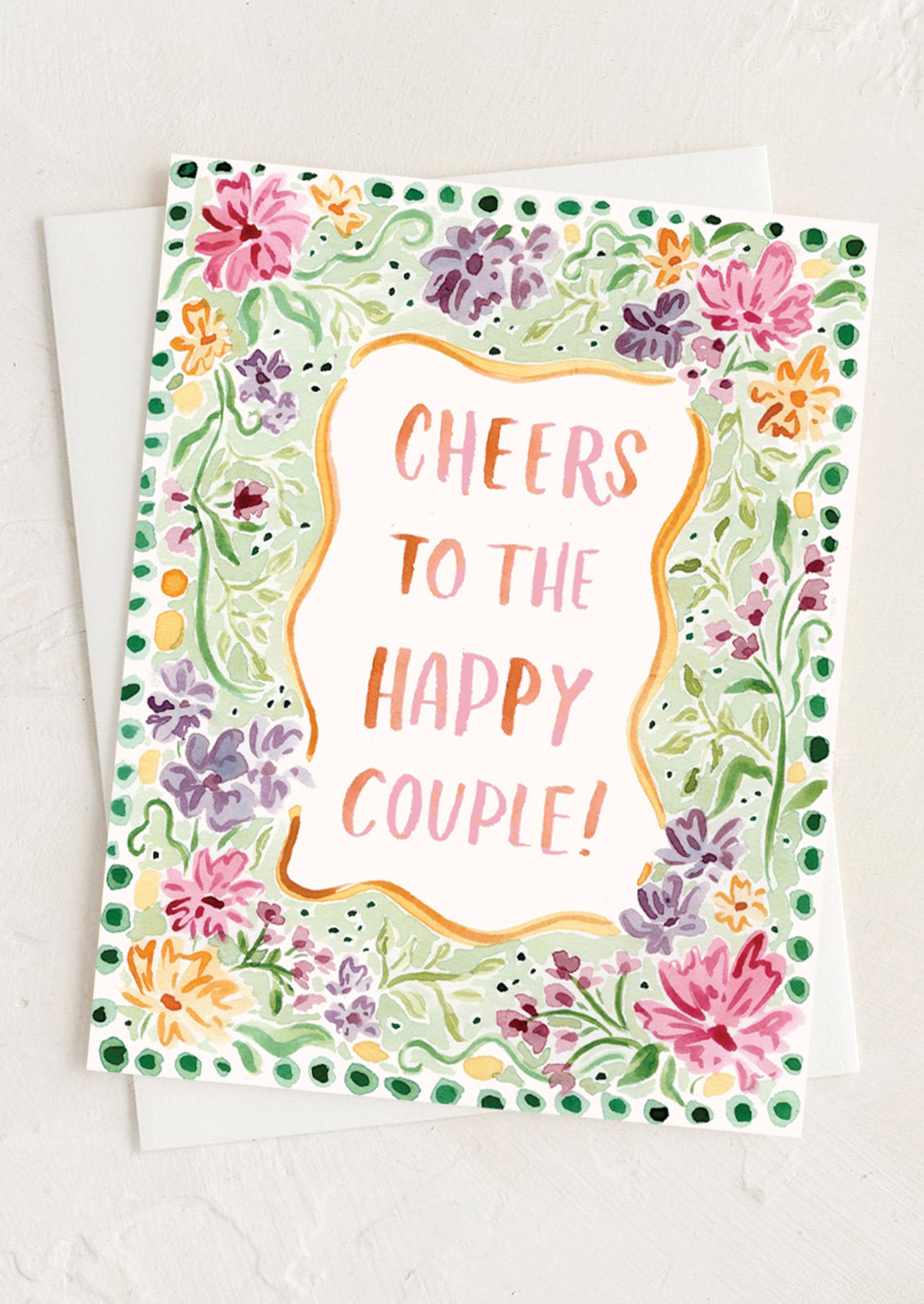 Greeting card with floral border and 'Cheers to the Happy Couple!' text on a white background
