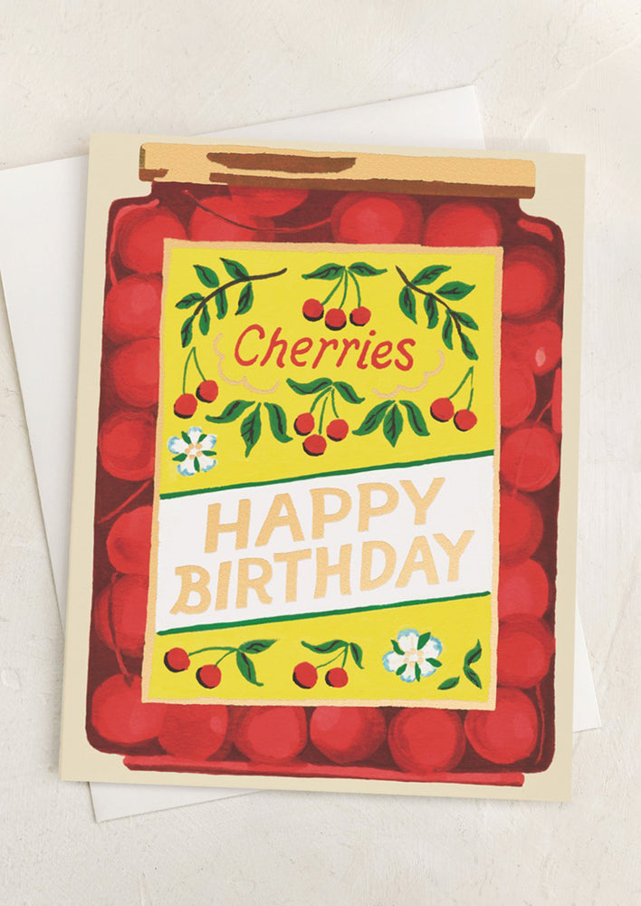 A card that looks like a jar of cherries, text reads "Happy Birthday".
