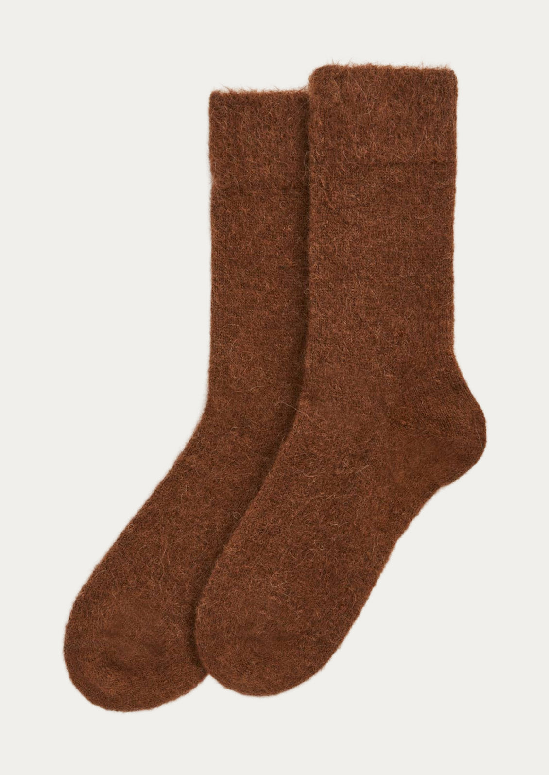 A pair of textured alpaca blend, calf-length socks in chestnut brown.