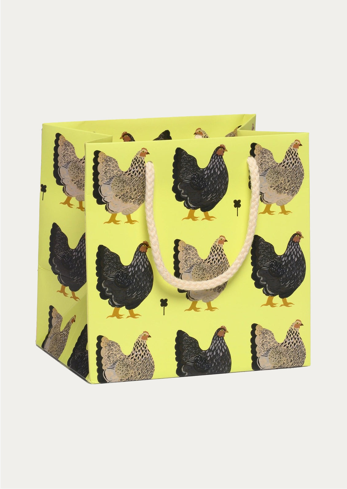 Gift bag with chicken pattern on a neon yellow background
