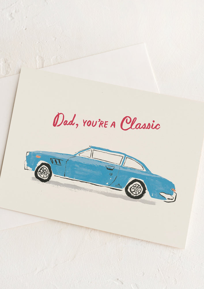 A card with illustration of classic blue card, red text reads "Dad, you're a classic".