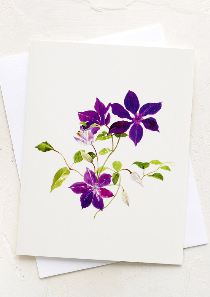 1: A greeting card with illustration of purple clematis.