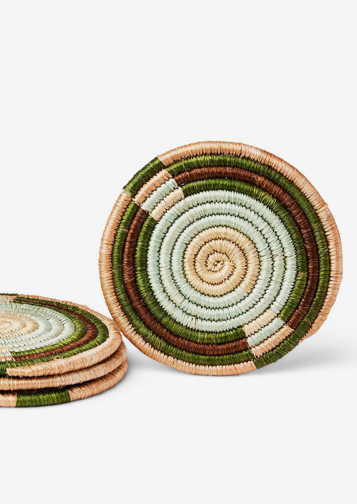 1: A set of colorblock sweetgrass coasters in earth tone color palette.
