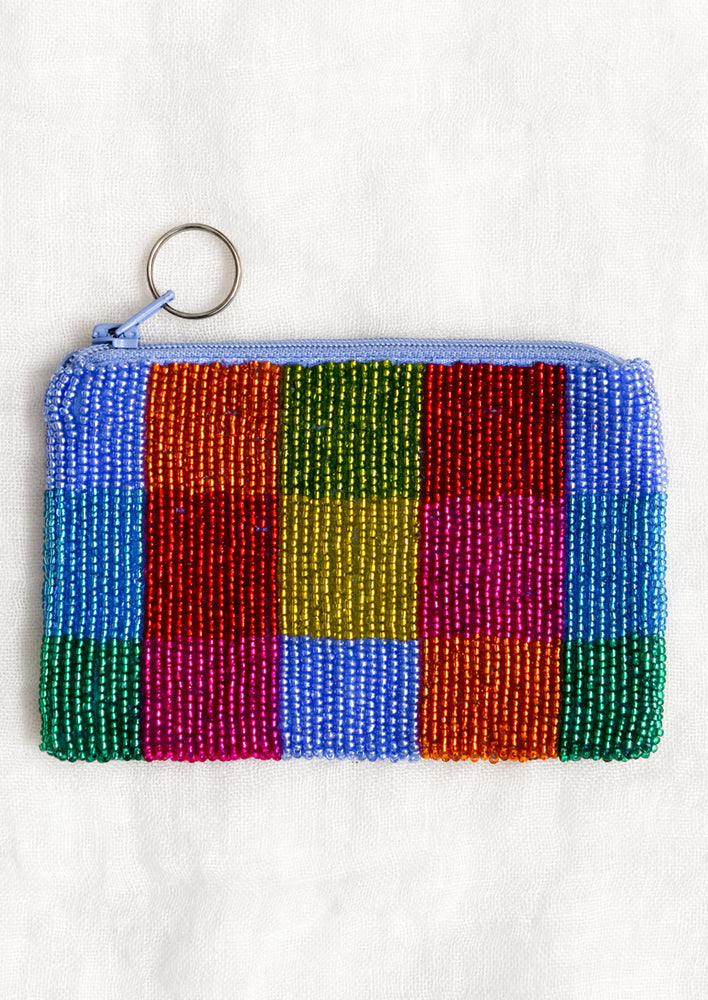 A beaded coin pouch in multicolor checker pattern.