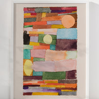 2: An art print of colorful abstract shapes stacked together, in white frame.