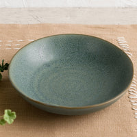 1: A mossy green-blue shallow ceramic bowl.