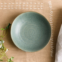 2: A mossy green-blue shallow ceramic bowl.