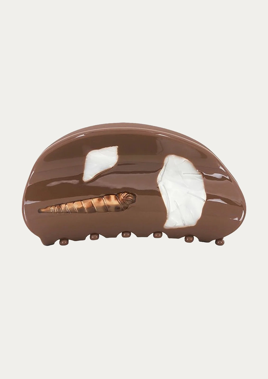 A brown hair clip adorned with seashells.