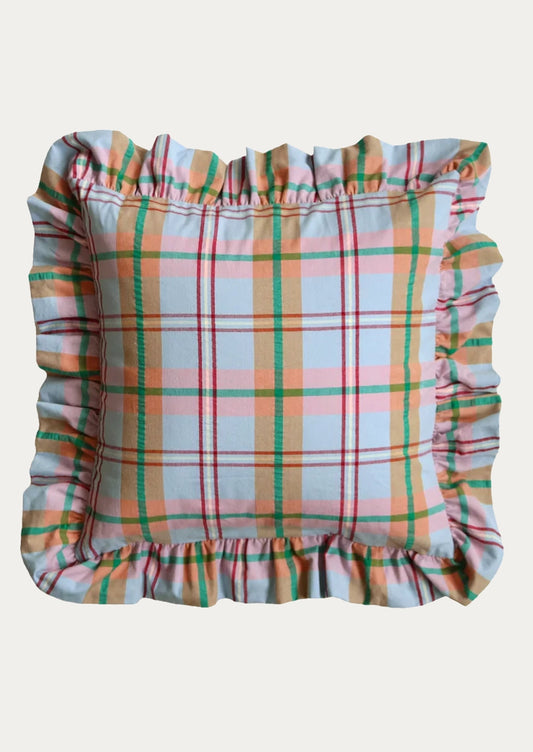 A square decorative throw pillow with a ruffled border, featuring a pastel plaid pattern in light blue, peach, orange, and green on a light gray background.