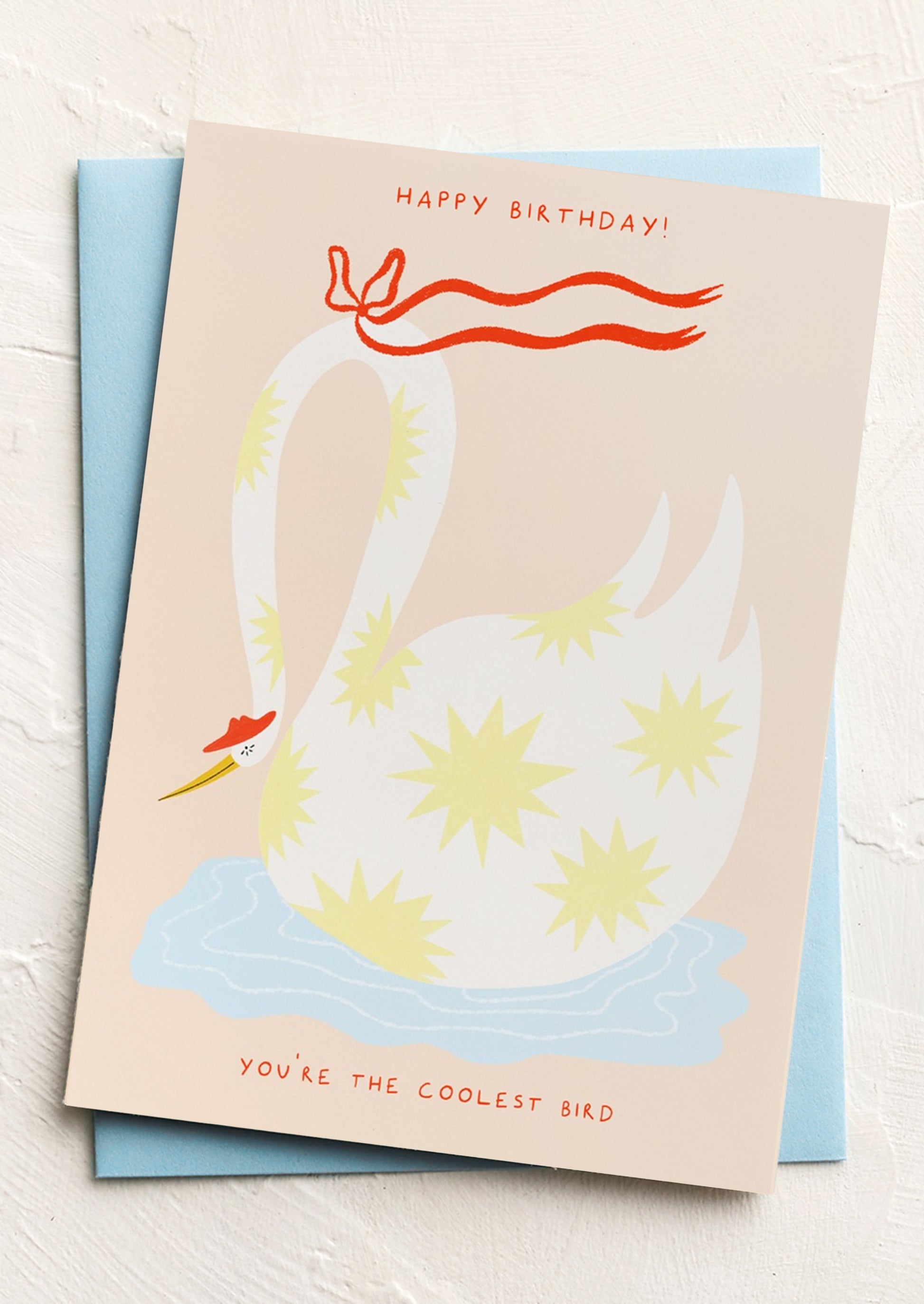 A greeting card reading "Happy Birthday! You're the coolest bird".