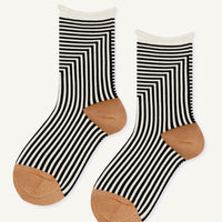 1: Black and white geo stripe socks with camel colored contrast.