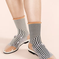 2: Black and white geo stripe socks with camel colored contrast.