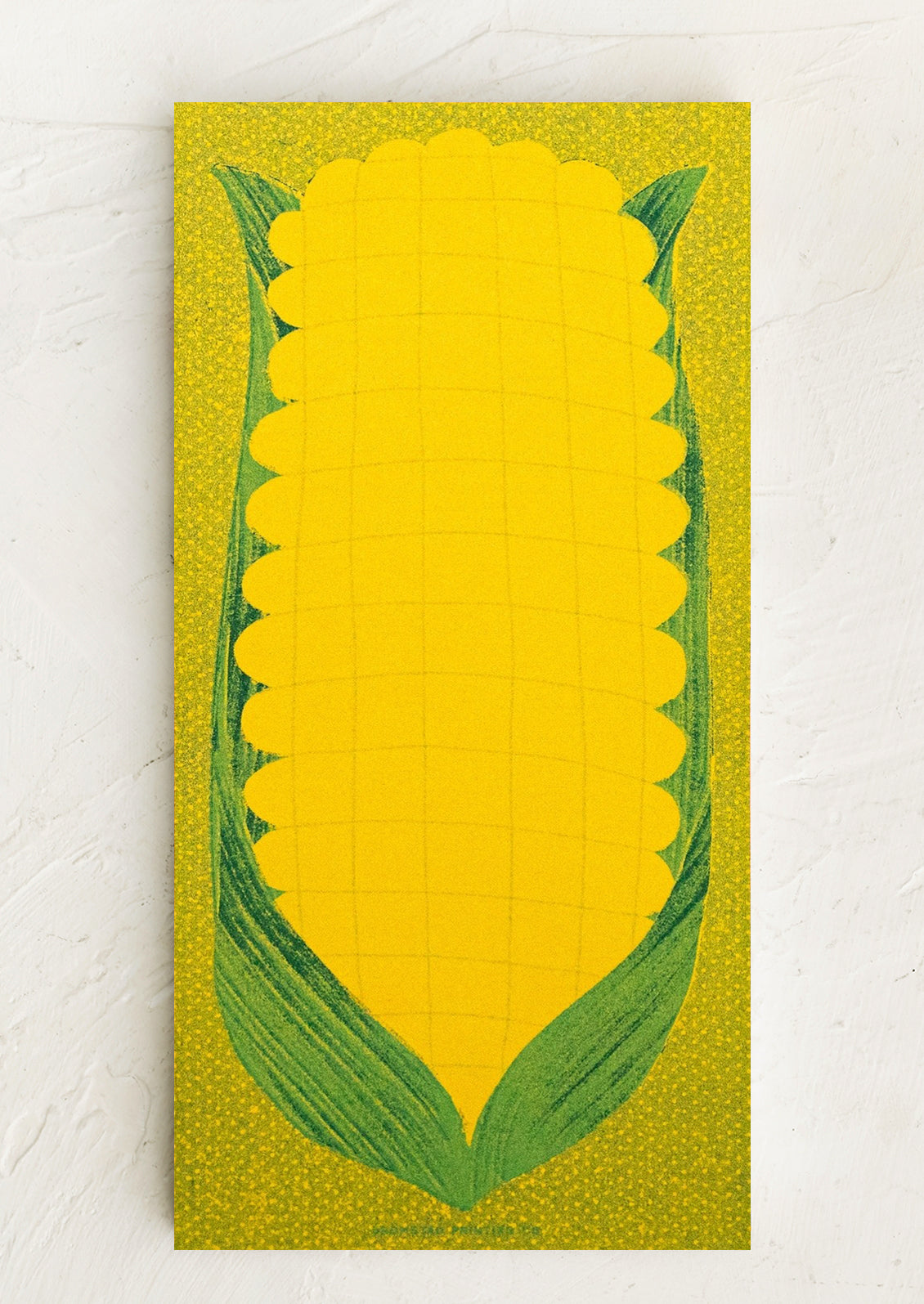 Corn design notepad on a green background