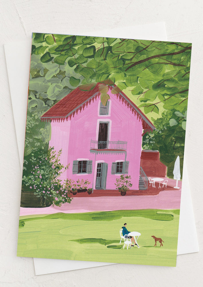 1: A text free card with illustration of pink house in the country.