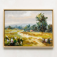 1: A framed original oil painting of a colorful meadow in the countryside.