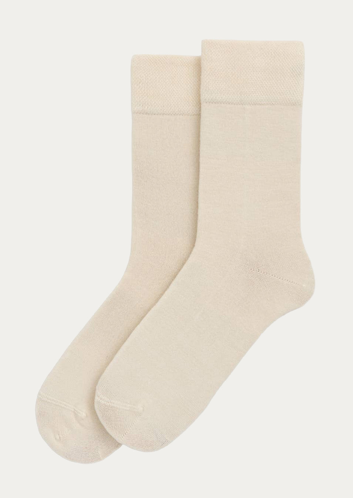 A pair of cream bamboo blend calf-length crew socks.