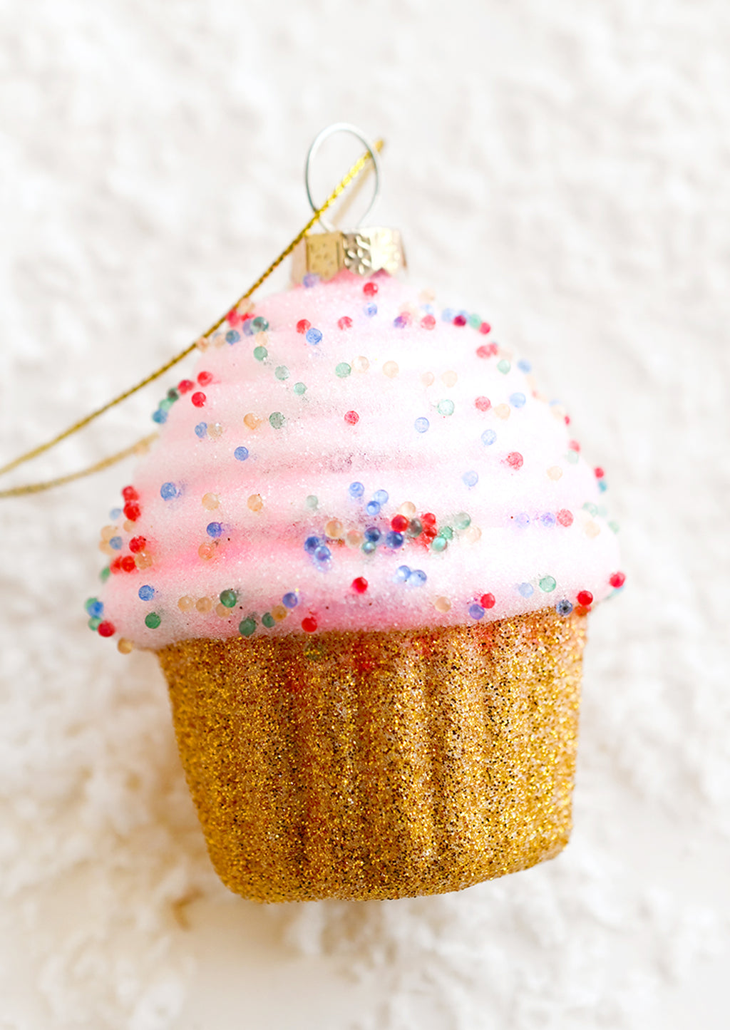 1: A holiday ornament of a pink cupcake.