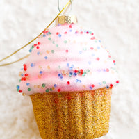 1: A holiday ornament of a pink cupcake.