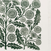 2: A woodblock print of dandelion flowers in dark green ink.