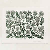 1: A woodblock print of dandelion flowers in dark green ink.