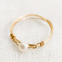 3: A gold wire ring with single pearl bead.