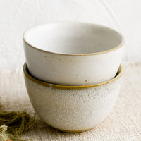 3: Two small ceramic bowls in natural speckle glazes.