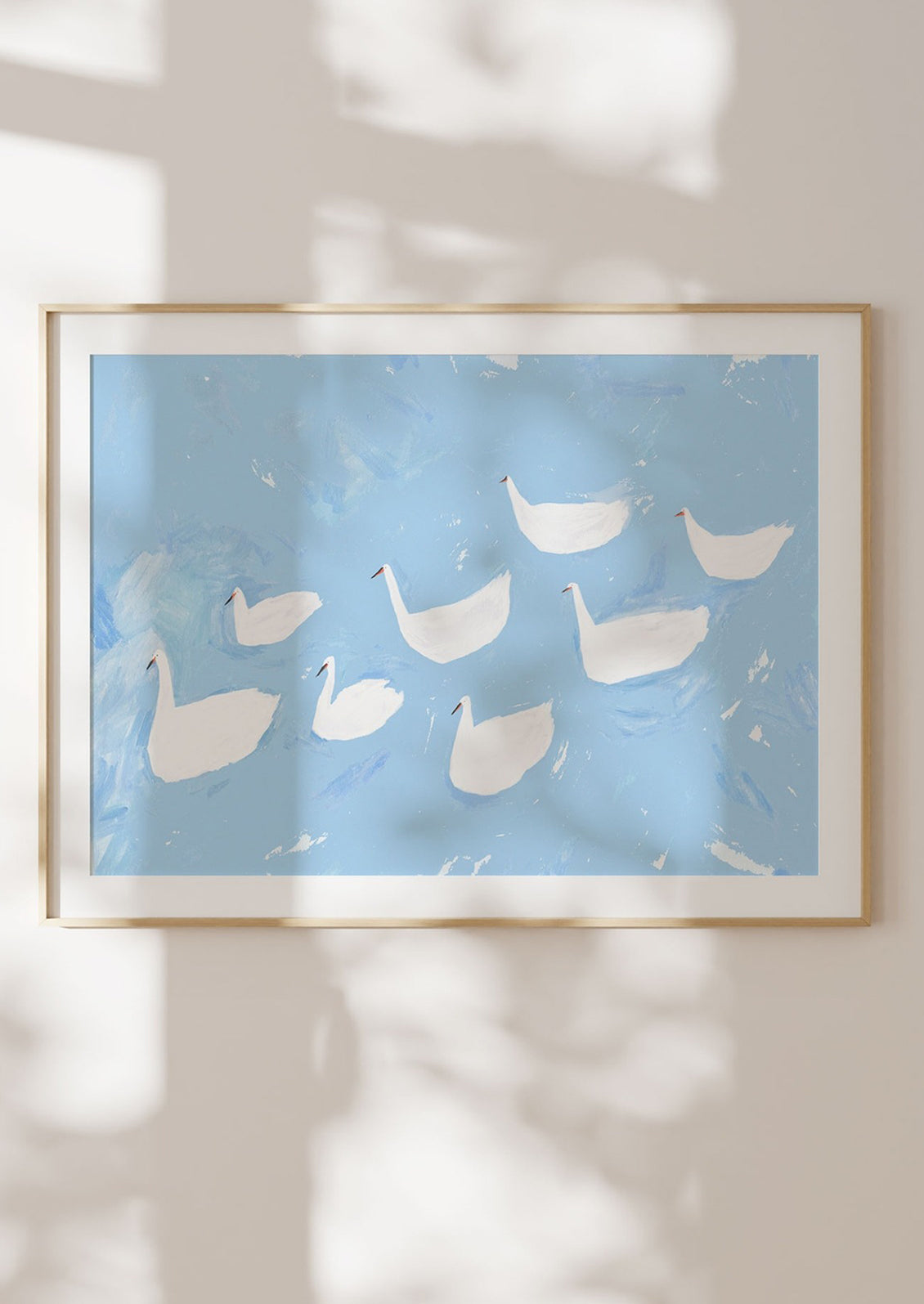 An art print of an illustration of white swans on sky blue water.