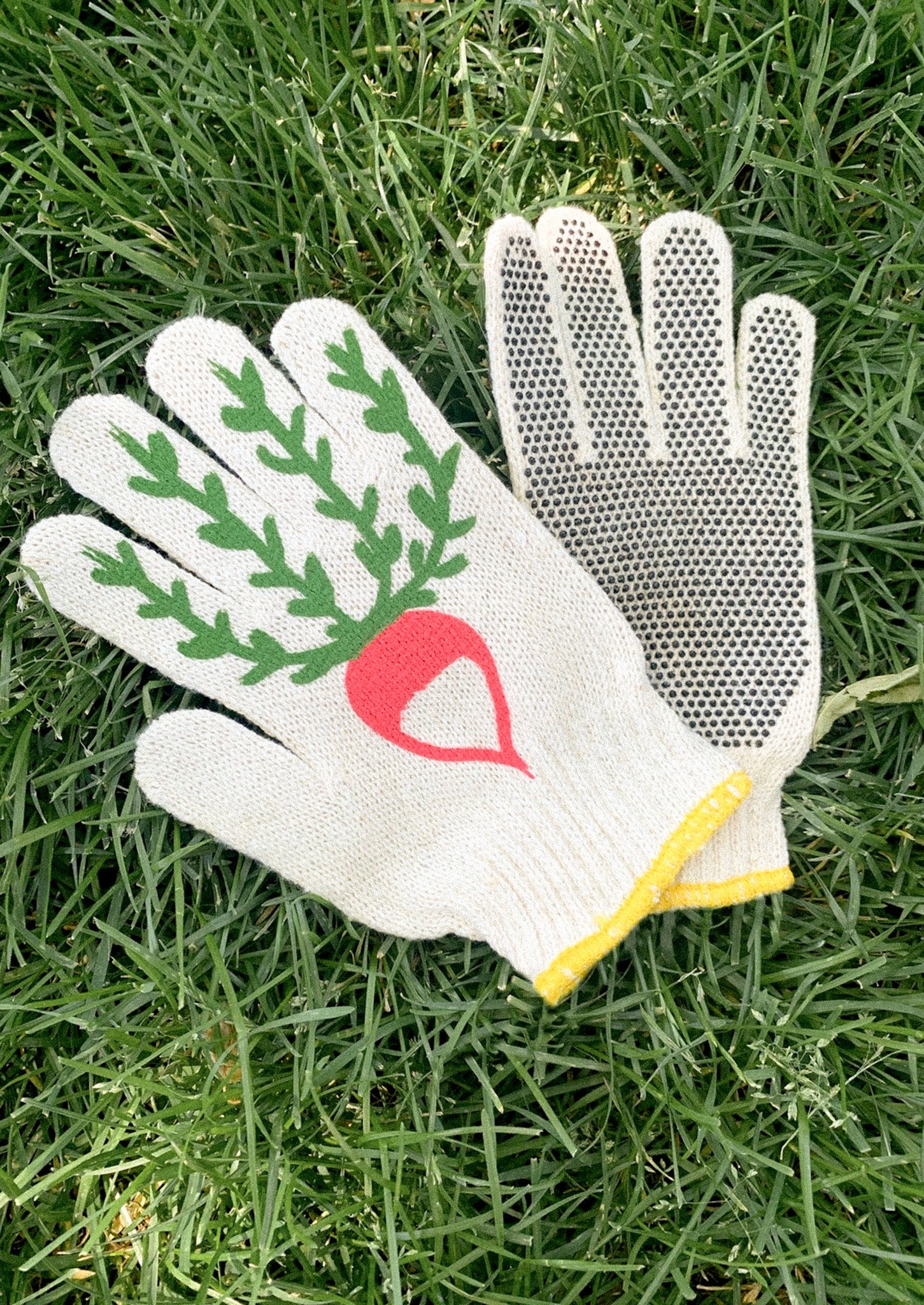 Gardening glove with a radish design on grass