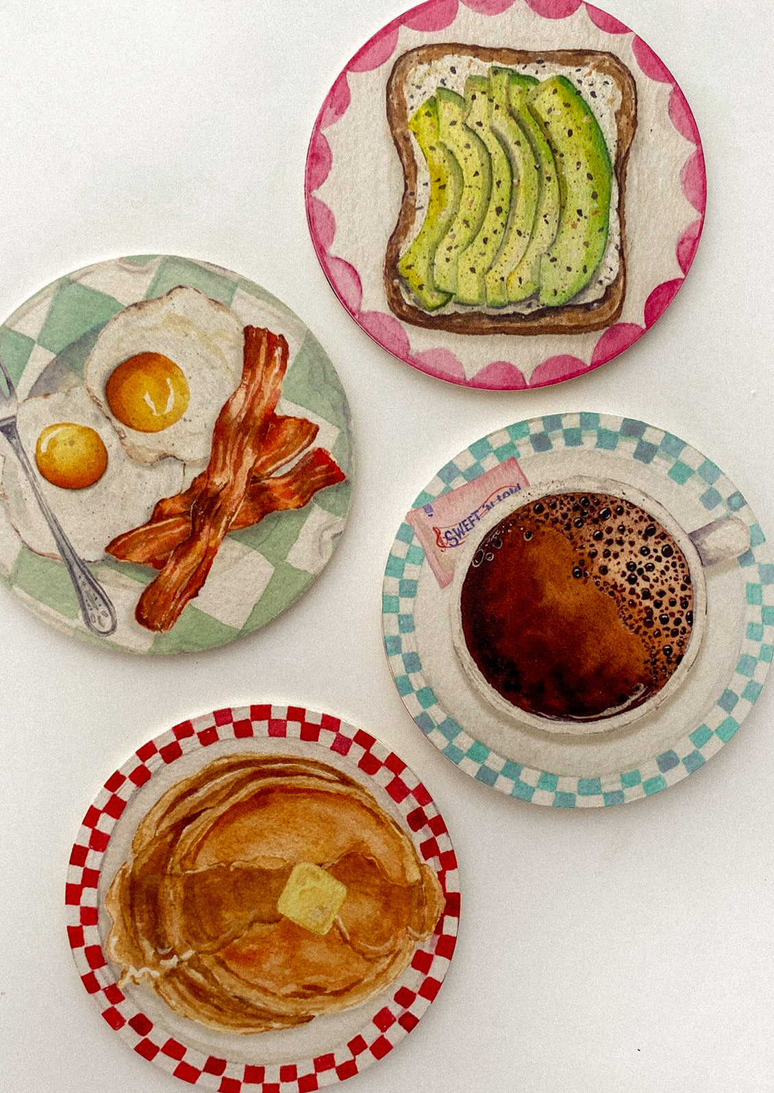 A set of coasters with breakfast plates print.