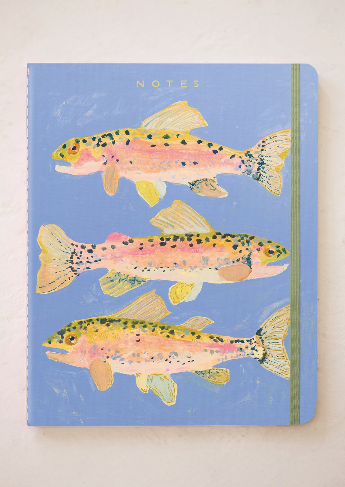 Notebook with fish illustrations on a blue background