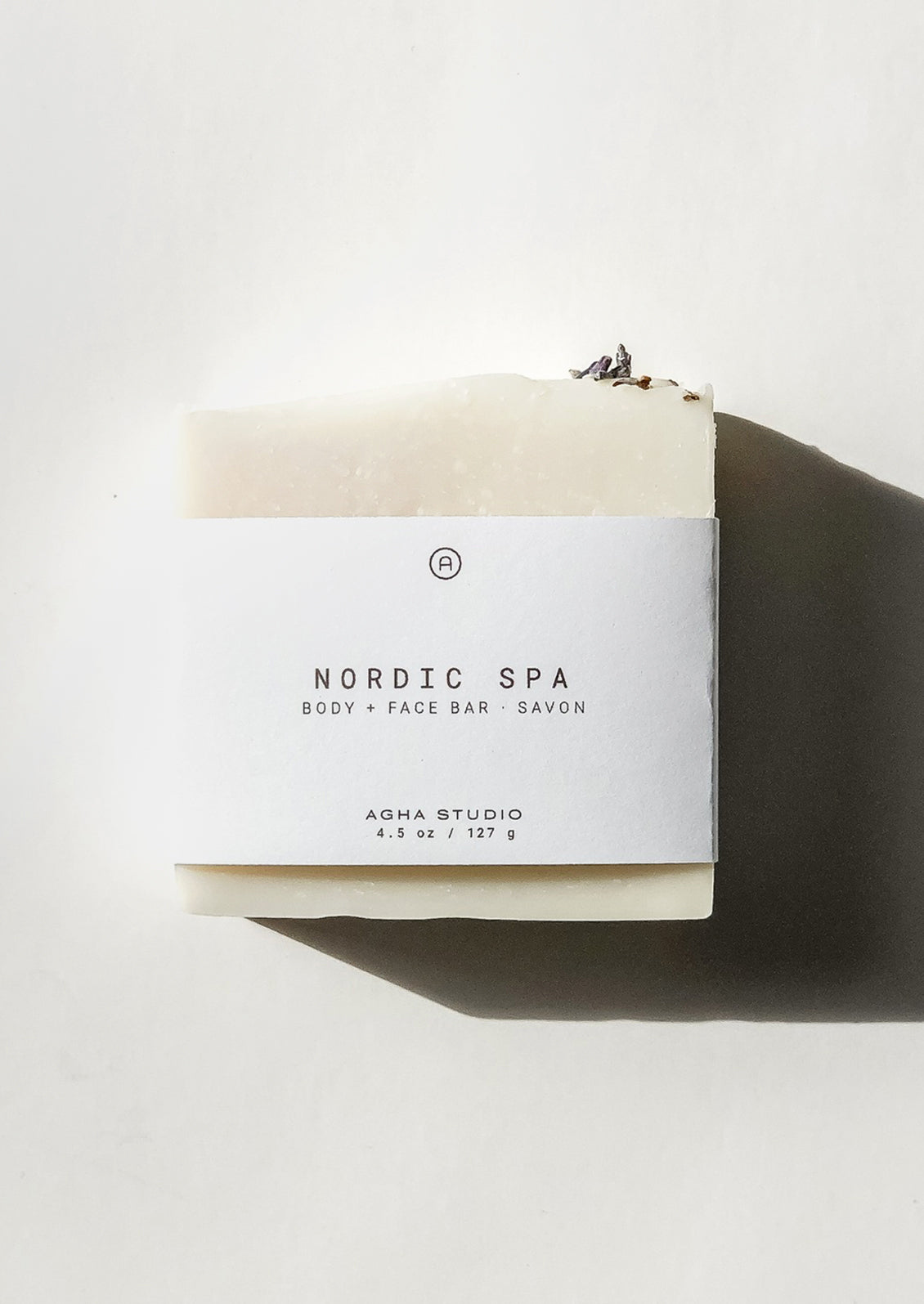 Bar of soap with a white label on a light background