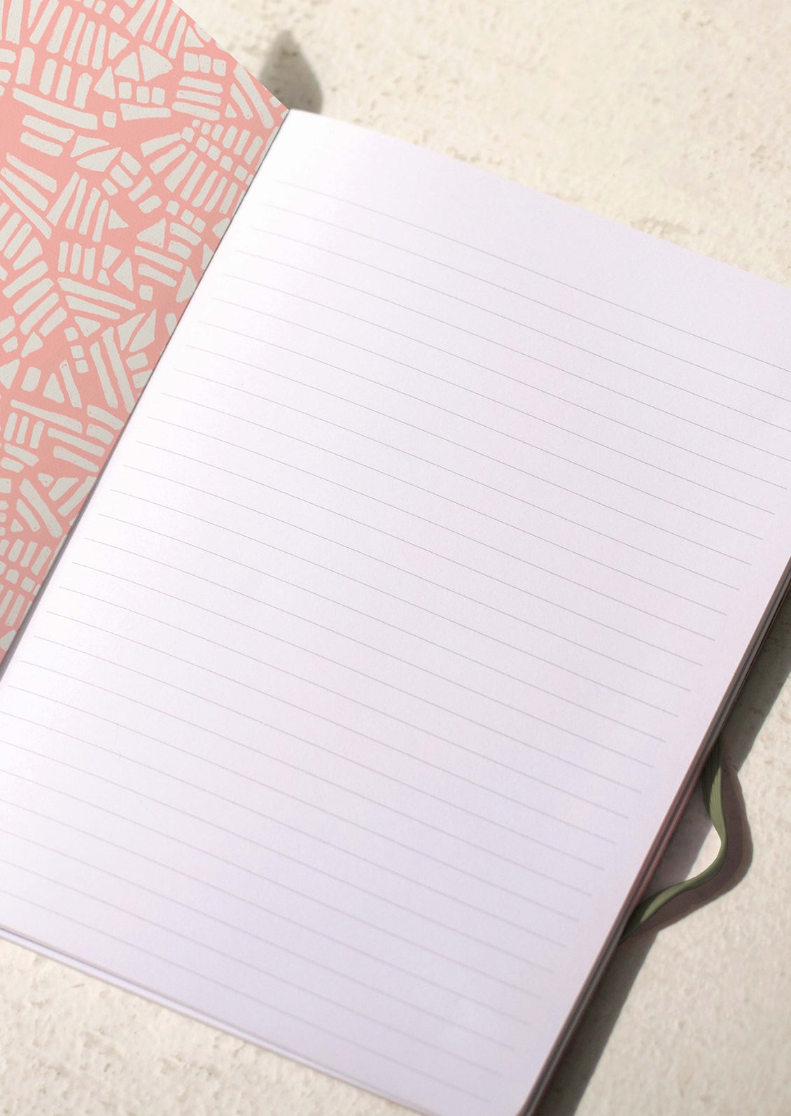 Ruled pages in a notebook.