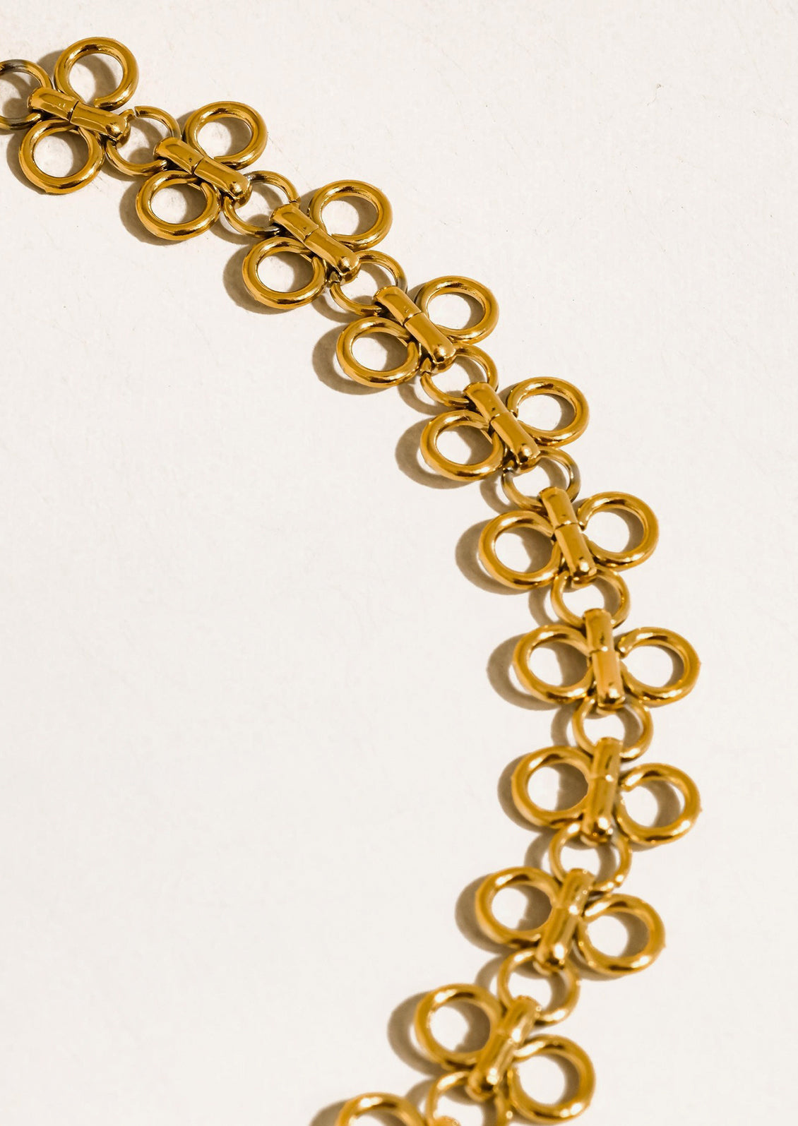 Gold chain necklace on a white background