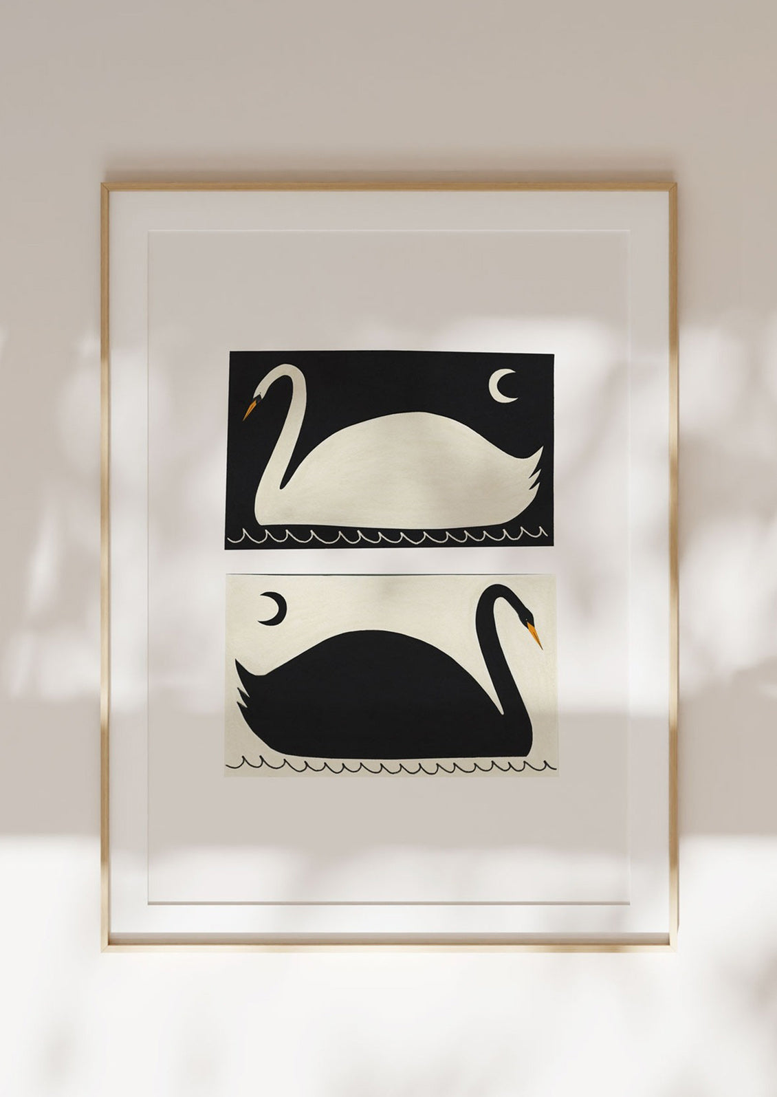 An art print with two stylized illustrations of swans in inverse black and white on a white background.