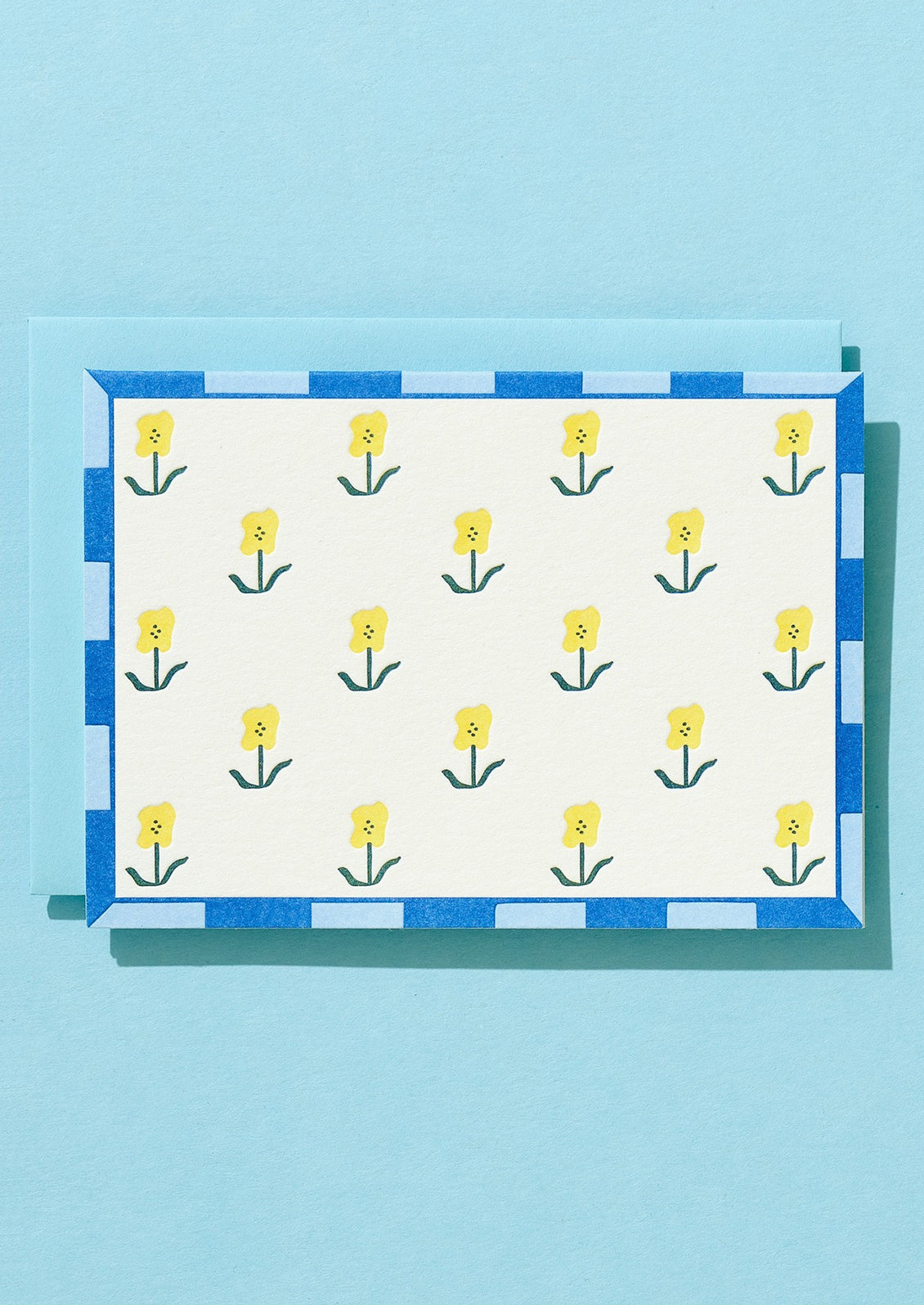 Greeting card with yellow floral design.