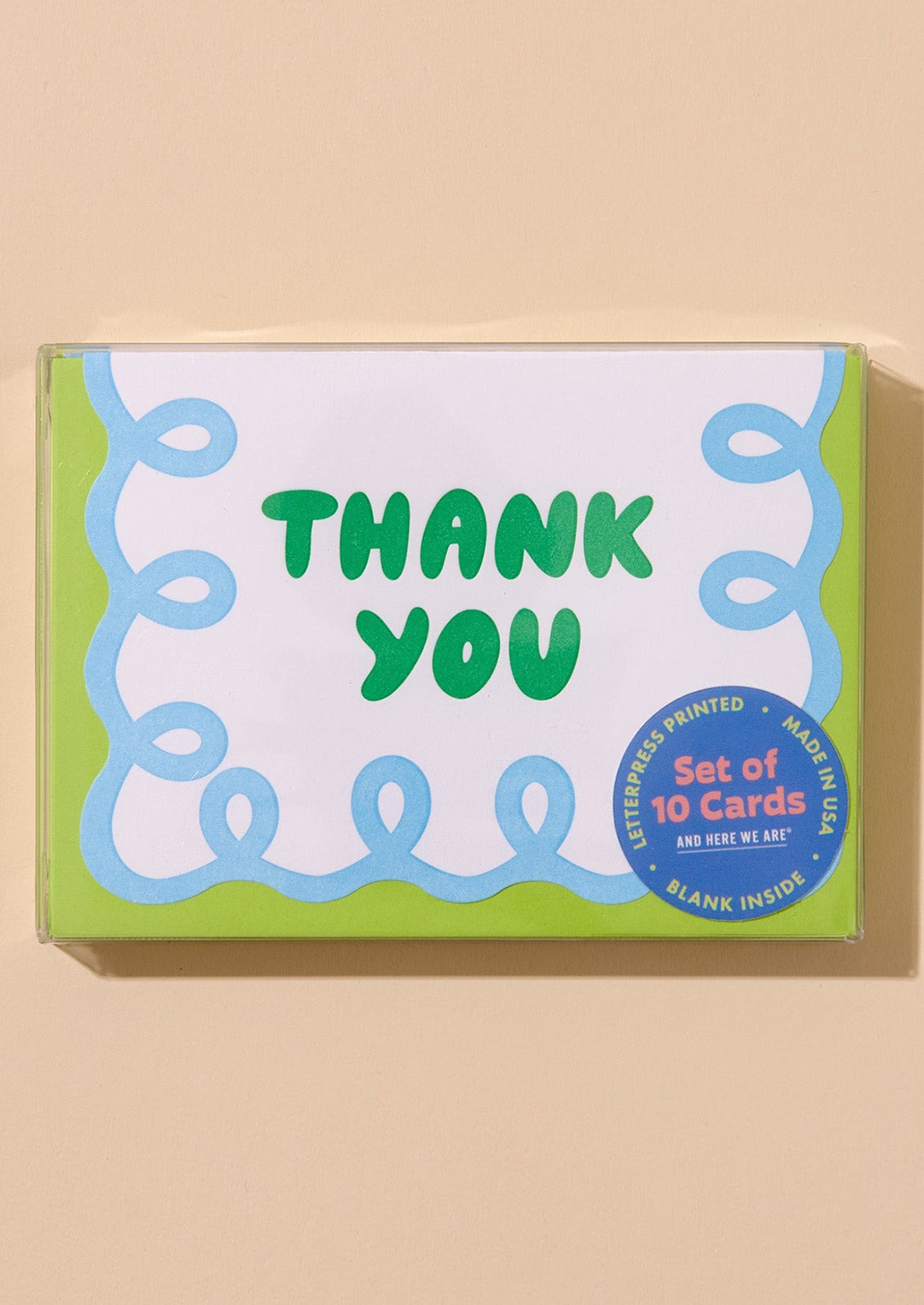 Box of 'Thank You' cards with green text on a beige background