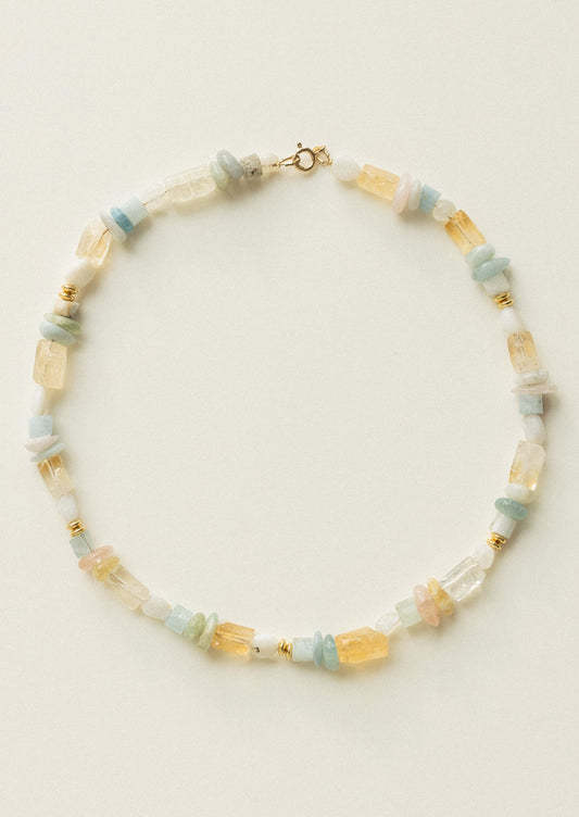 Necklace with multicolored beads on a light background