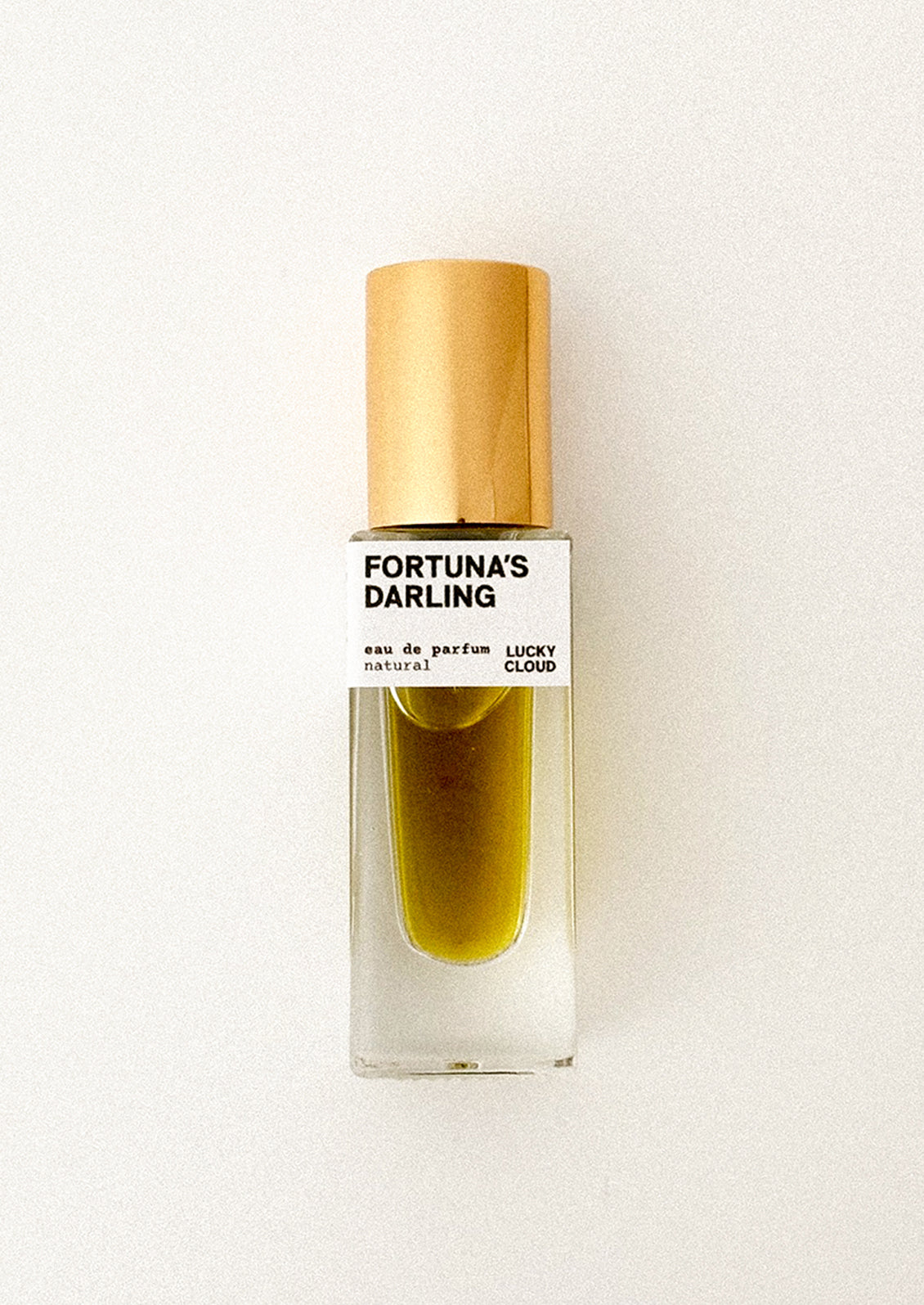 Perfume bottle labeled 'Fortuna's Darling' on a white background