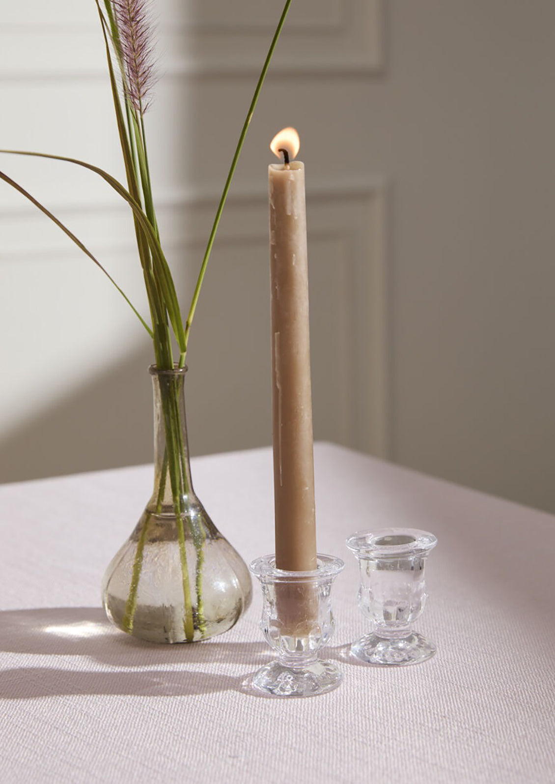 A clear glass candleholder with classic shape.