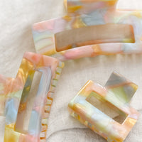 1: Hair claws in pastel, prismatic colors.