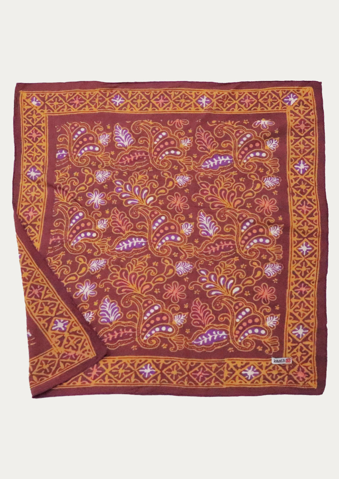 A dark red cotton bandana with orange, coral and purple paisley print.