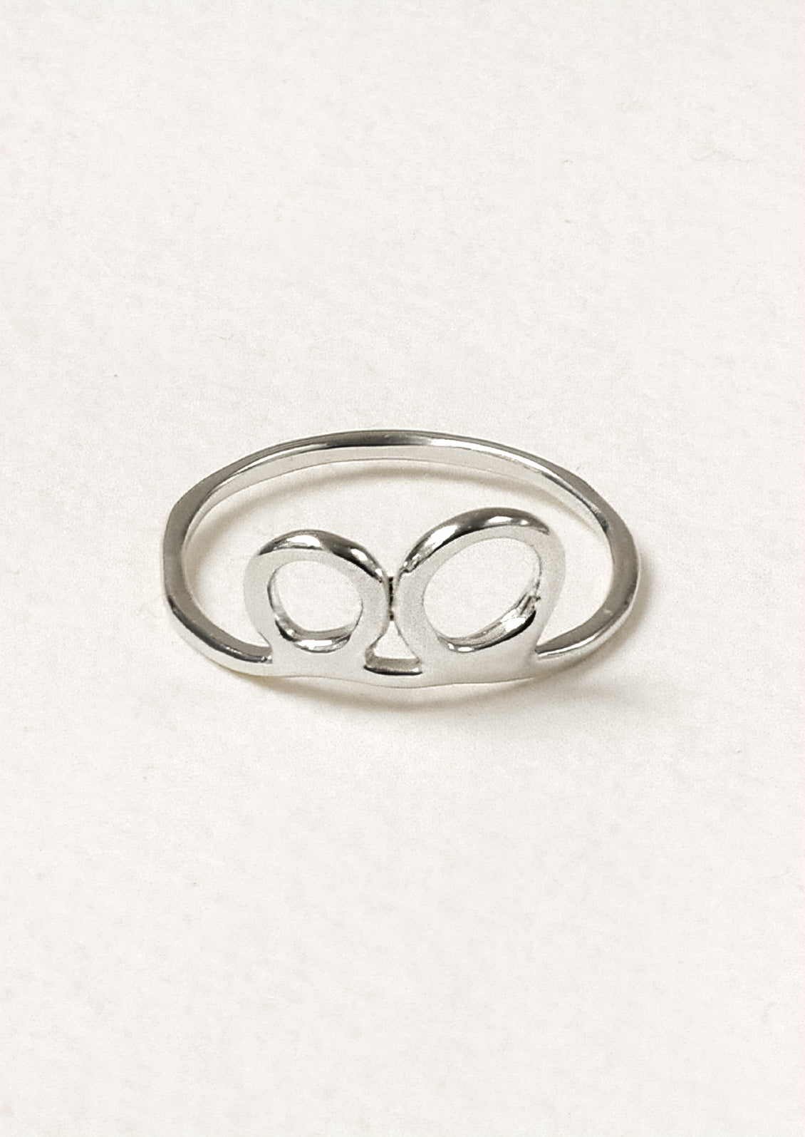 A sterling silver ring with a double circle design.