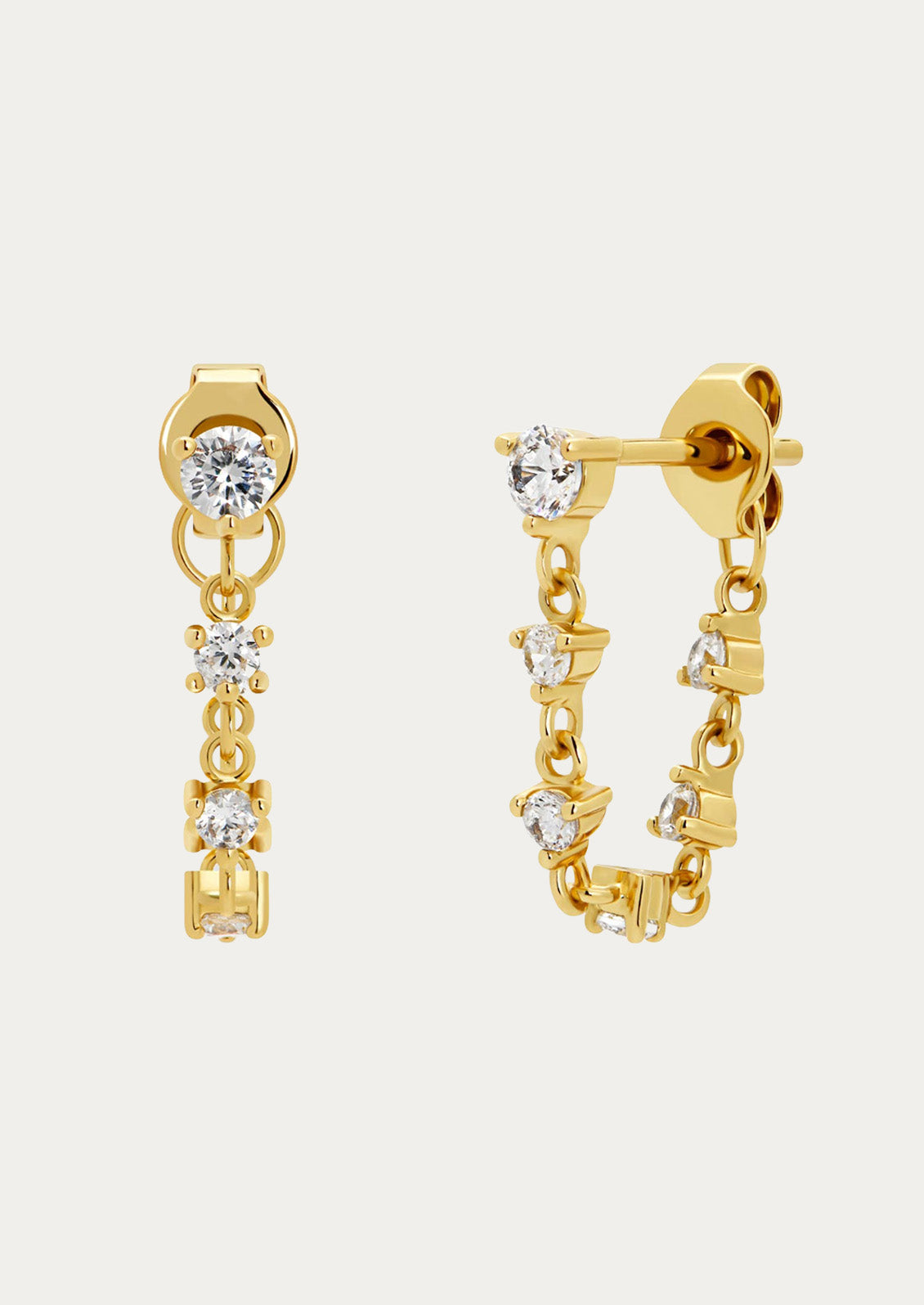 A pair of gold chain stud earrings adorned with cubic zirconia gems throughout on a white background.