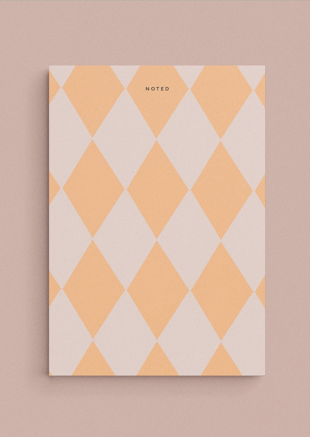 Lavender / Creamsicle Multi: A diamond print notepad in peach and blush reading "NOTED" at the top.