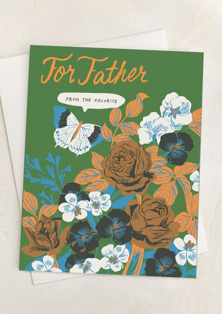 A card reading "For father, from the favorite" with floral print in green.