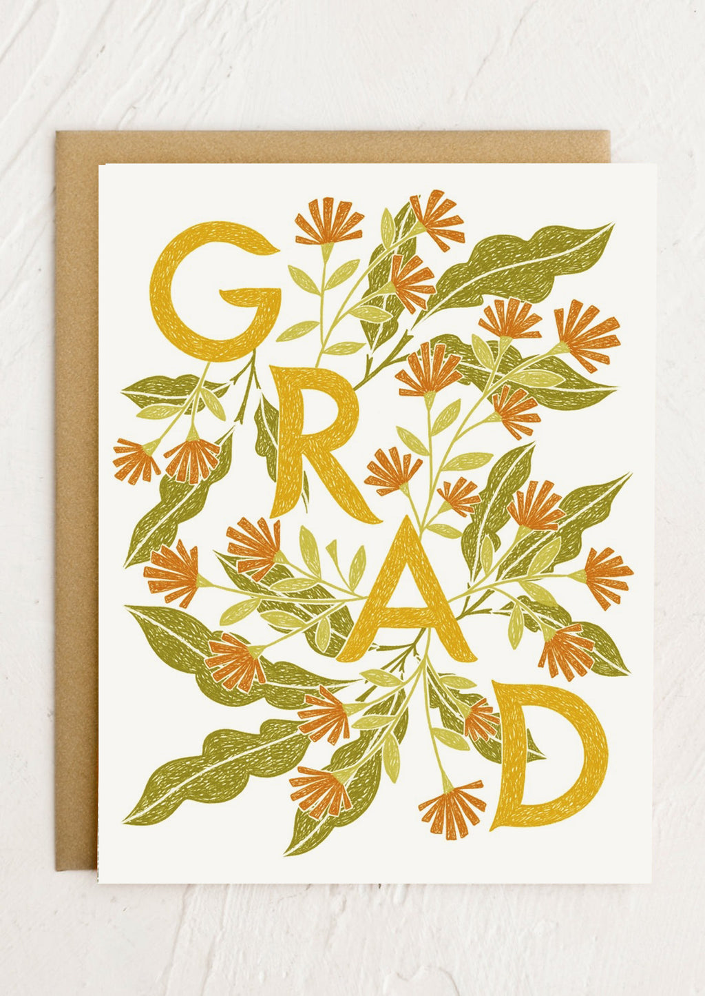 1: A floral print card reading "GRAD".