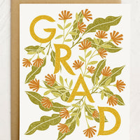 1: A floral print card reading "GRAD".