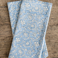 3: A pair of blue and white colored napkins with floral print.