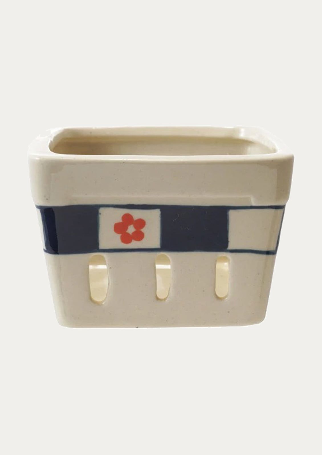 Ceramic berry basket with a floral design.