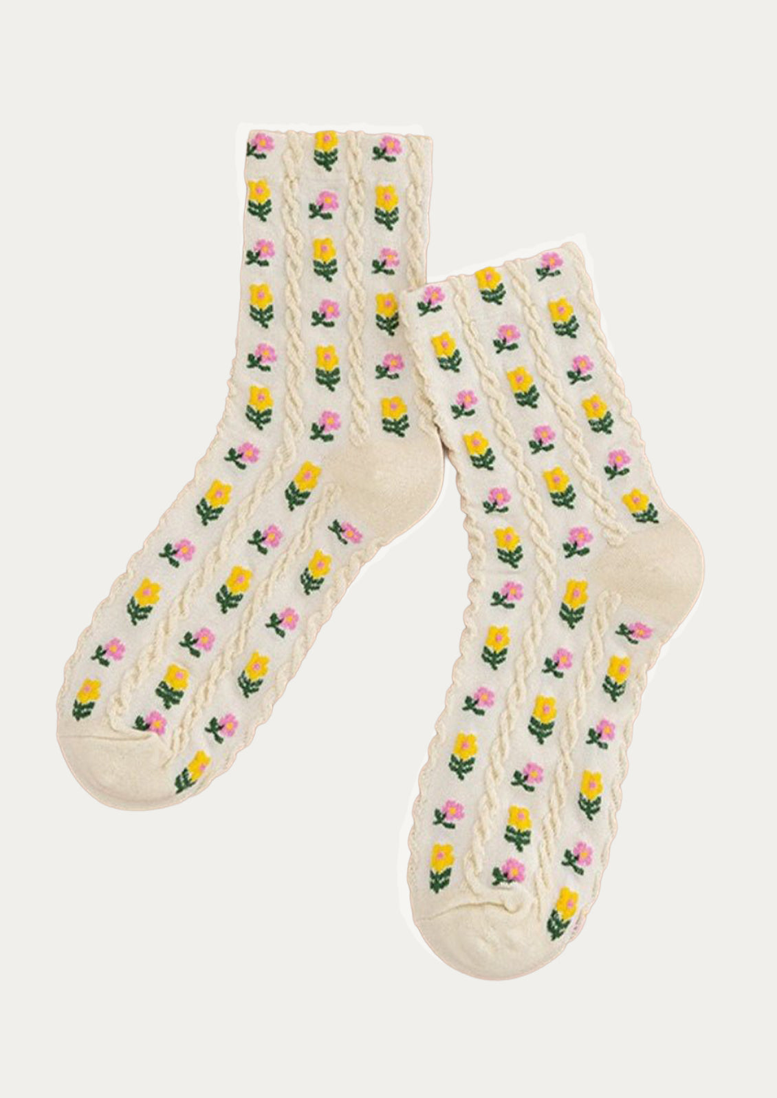 A pair of cream crew socks with small pink and yellow flowers throughout.